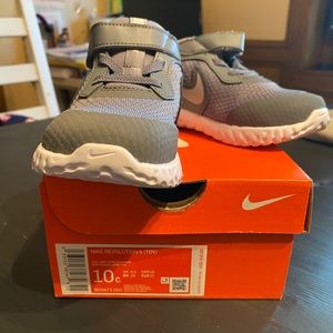 Kids Nike Revolution running shoes.
